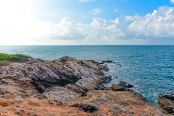 Fototapeta na wymiar View of sea waves and fantastic rocky coast landscape - Seascape rock tropical island with ocean and blue sky background in Thailand