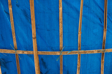 blue plastic roof with bamboo
