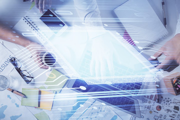 Double exposure of man's hands typing over computer keyboard and data theme hologram drawing. Top view. Technology concept.