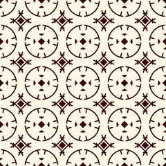 Ethnic, tribal wallpaper. Repeated segmented circles seamless pattern. Openwork ornament. Delicate ornamental background