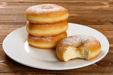 donuts with a bite on a dish