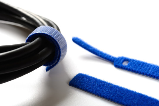 Blue Velcro Cable Tie And Cable On White