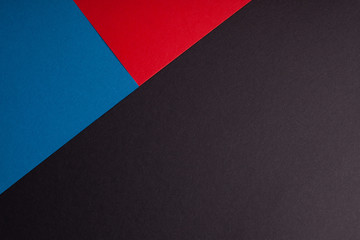 Black, red, blue color of paper background, texture, copy space, diagonal.