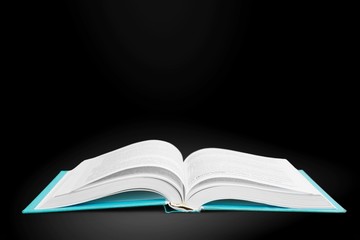 Open book on  table, wisdom and learning concept
