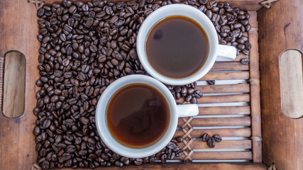 Dark rose Coffee Beans and coffee cup Background