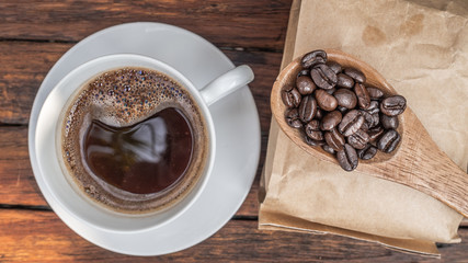Dark rose Coffee Beans and coffee cup Background