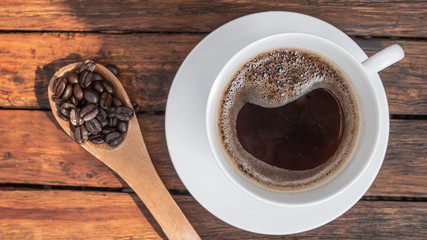 Dark rose Coffee Beans and coffee cup Background