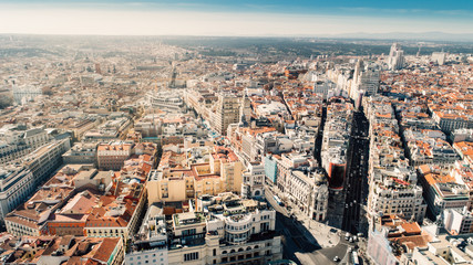 Naklejka premium Aerial view of Calle de Alcala and Calle Gran Via.Panoramic aerial view of Gran Via, main shopping street in Madrid, capital of Spain, Europe.Tourist attraction and most famous street.