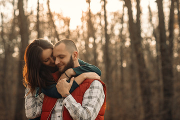 couple in love cuddles in the autumn forest