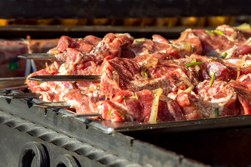 cooking barbecue on the street. meat food. quick snack
