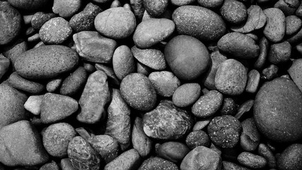 black stone background. pebbles on the beach.