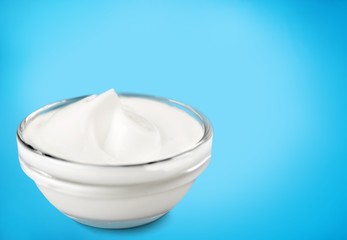 Sour cream, mayonnaise or yogurt in a bowl on the desk
