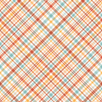 Colourful diagonal plaid seamless pattern background in brown , orange, blue and white.