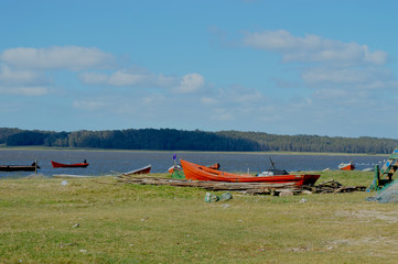 Fototapeta na wymiar Landscape of field, lagoon and boats