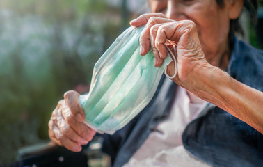 Elderly woman wearing a mask to protect from coronavirus covid-19