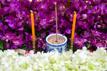 incense burner on beautiful orchid flower background in chinese funeral ceremony
