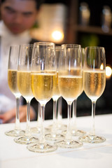 Champagne glasses on drink service counter