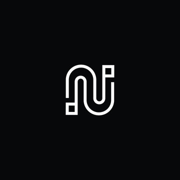 Minimal elegant monogram art logo. Outstanding professional awesome artistic Technology N NN NU UN initial based Alphabet icon logo. Premium Business Technology logo White color on black background
