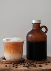 Ice coffee drink with foam and coffee beans  isolated on white background.