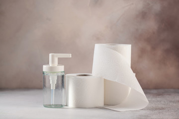 Close up of toilet paper and desinficant. Panic buying (Hamsterkäufe) because of coronavirus