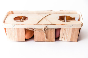 Ten natural fresh brown eggs in eco-friendly wooden packaging