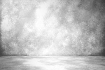 Empty room with white wall and concrete floor	