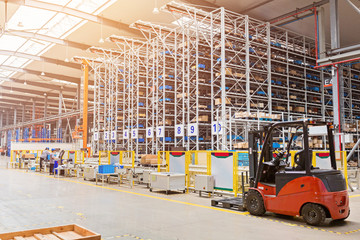 The warehouse full of goods, boxes and shelves. Industrial background container plant manufacturing manufacture production paperboard business deal