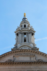 Fototapeta na wymiar Top part of St Paul's Cathedral against blue clear sky, London, UK