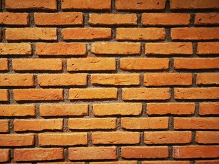 Old orange grunge brick wall background