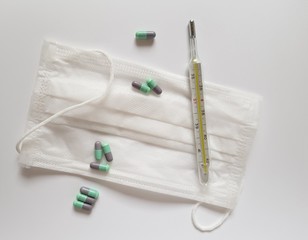 ampoules, mask and syringe on white background