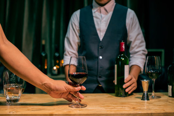 person with glass of wine