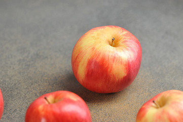 apples whole  on a gray background. red apples