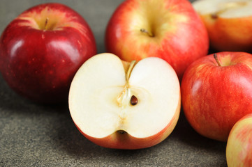 Naklejka na ściany i meble half of a red Apple. Apples on a gray