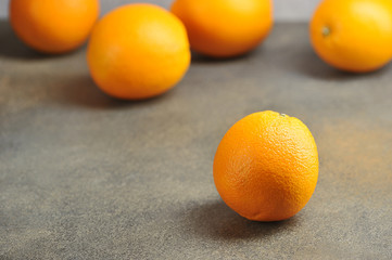orange color of ripe oranges on a gray background