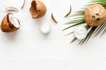 Homemade coconut cream on white wooden background top-down frame copy space