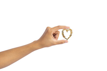 A hand holding money, International cash including European, Hongkong, Malaysia, Thai coin, they are golden, silver and bronze coins collocate in a heart shape isolated on white with clipping path