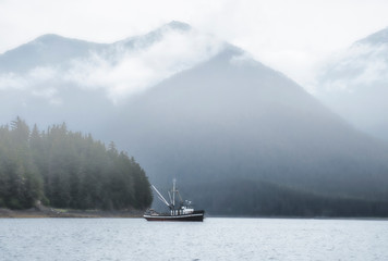 Commercial fishing boat in Southeast Alaska in fog
