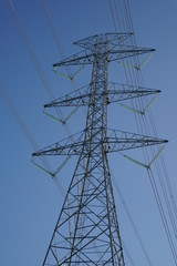 power transmission tower on background of blue sky
