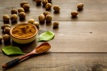 Nutmeg - still life with asian spices - on wooden background copy space