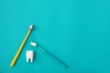 Tooth brushes with paste on color background
