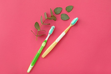 Tooth brushes with paste on color background