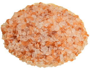 Coarse sea salt in a glass plate on a wooden background