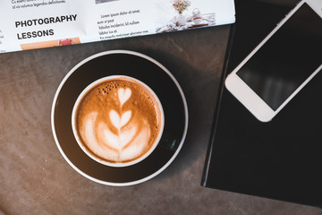 Cup of tasty cappuccino on grey table