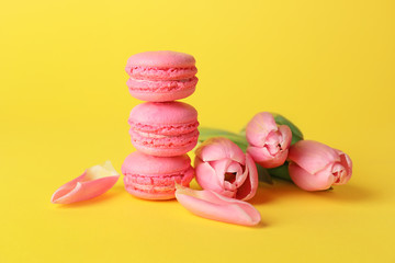 Tasty macarons on color background