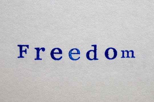 a freedom word stamped on a piece of paper.