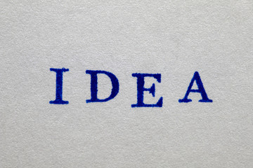 a idea word stamped on a piece of paper.