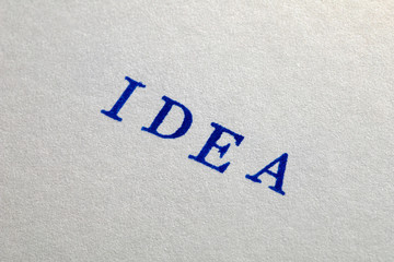 a idea word stamped on a piece of paper.