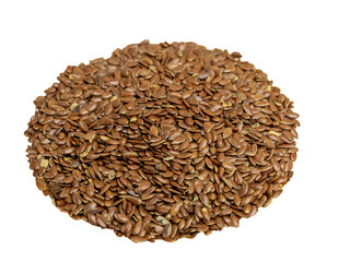 Flax seeds in a glass plate on a wooden background