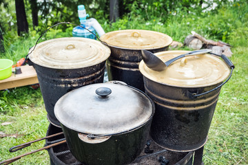 Charity outdoor food. Large buckets of food for a charity lunch.