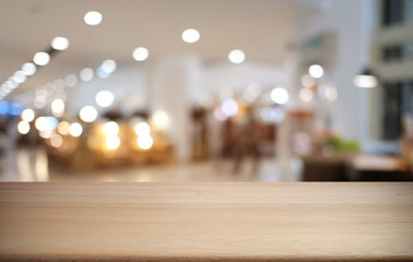 Empty dark wooden table in front of abstract blurred bokeh background of restaurant . can be used for display or montage your products.Mock up for space.